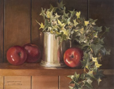 Three apples under a tin of herbs